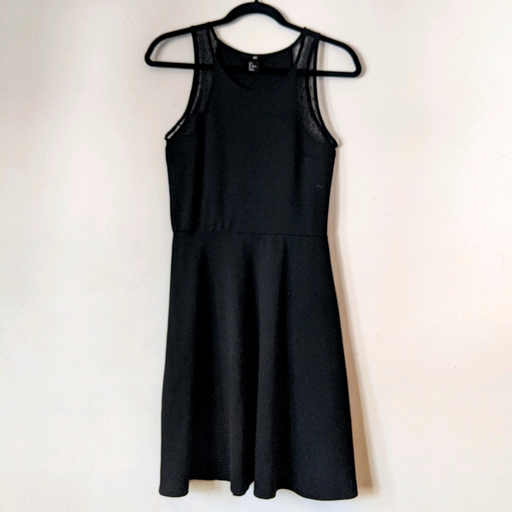 Black sleeveless A-line dress